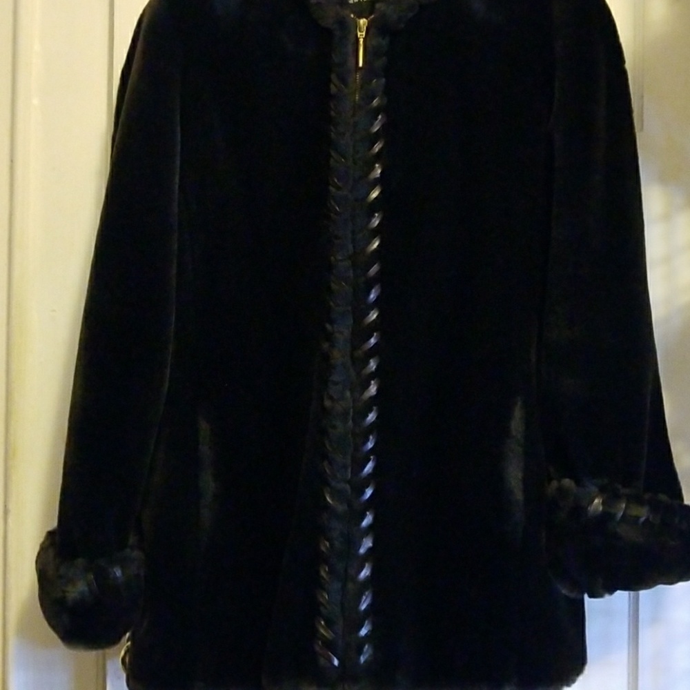 Dark fur coat with leather decorations